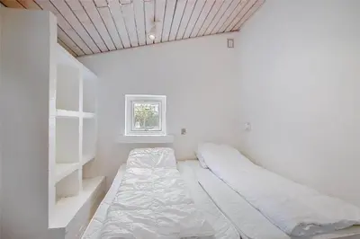 a white room with two beds and a window at JB640-Fjerritslev-Bjerregardsboulevarden-8 in Fjerritslev
