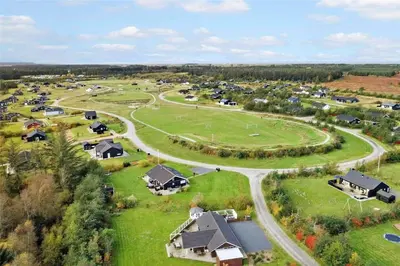 an aerial view of a village with houses and a road at JB876-Brovst-Kronvildtvej-40 in Brovst