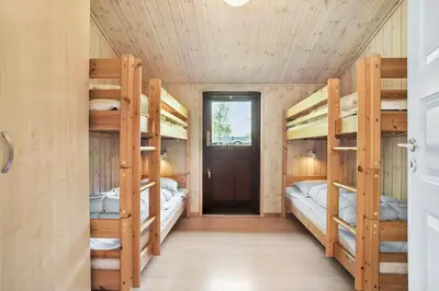 a room with four bunk beds and a door at JB126-Fjerritslev-Tyttebaerstien-48 in Fjerritslev