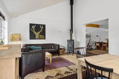 a living room with a couch and a table at JB175-23-Brovst-Kronvildtvej-60 in Brovst