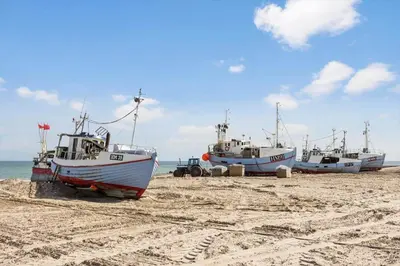 three boats sitting on the sand on a beach at JB318-Fjerritslev-Fiskerstien-10 in Fjerritslev