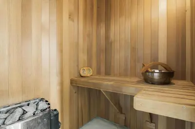 a wooden shelf in a sauna with a bowl on it at JB239-Brovst-Kronvildtvej-208 in Brovst