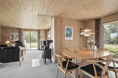 a dining room with a table and chairs at JB102-Fjerritslev-Blabaerstien-7 in Fjerritslev