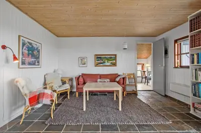 a living room with a couch and a table at JB144-Frostrup-Horsbakkevej-7 in Frøstrup