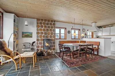 a kitchen and dining room with a table and chairs at JB144-Frostrup-Horsbakkevej-7 in Frøstrup