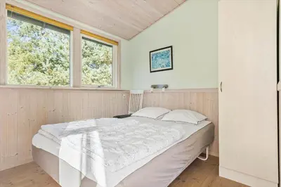 a bedroom with a bed in a room with a window at JB759-Fjerritslev-Revlingestien-45 in Fjerritslev