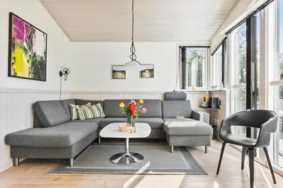 a living room with a couch and a table at JB759-Fjerritslev-Revlingestien-45 in Fjerritslev