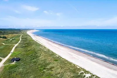 an aerial view of a beach near the ocean at JB696-Fjerritslev-Blabaerstien-56 in Fjerritslev