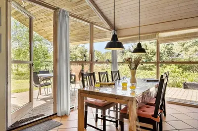 a dining room with a table and chairs at JB304-Fjerritslev-Landstien-4 in Fjerritslev