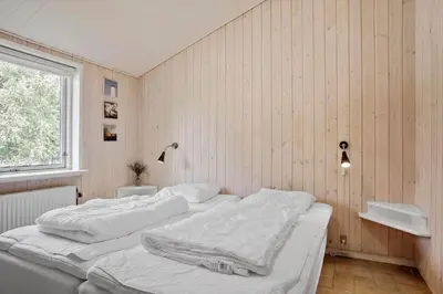 a bedroom with two white beds and a window at JB182-Fjerritslev-Gyvelstien-39 in Fjerritslev