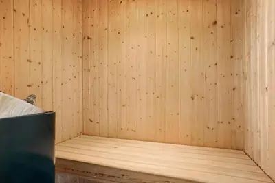 a corner of a sauna with a wooden wall at JB203-Brovst-Kronvildtvej-35 in Brovst
