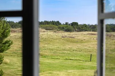 a view of a field from a window at JB325-Frostrup-Bulbjergvej-40 in Frøstrup