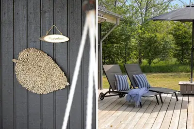 a patio with two chairs and an umbrella at JB161-Brovst-Kronvildtvej-206 in Brovst