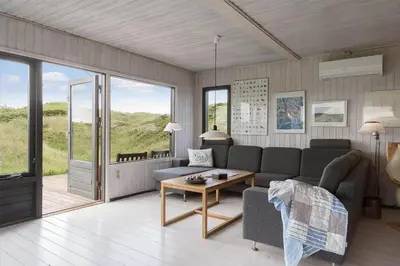 a living room with a couch and a table at JB233-Brovst-Ejstrup-Strandvej-24 in Brovst
