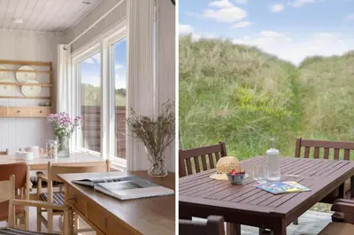 a dining room with a table and a window at JB233-Brovst-Ejstrup-Strandvej-24 in Brovst