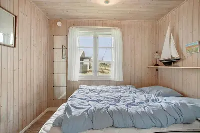 a bedroom with a bed in a room with a window at JB116-Frostrup-Svenstibakkevej-30 in Frøstrup