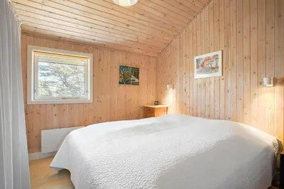 a bedroom with a white bed and a window at JB173-Brovst-Redningsvejen-28 in Brovst