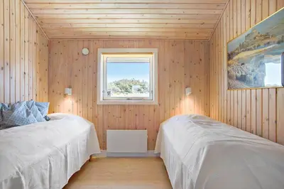 a bedroom with two beds and a window at JB173-Brovst-Redningsvejen-28 in Brovst