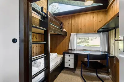 a bedroom with a desk and a bed in a tiny house at JB987-Fjerritslev-N-C-Alstedsvej-12 in Fjerritslev
