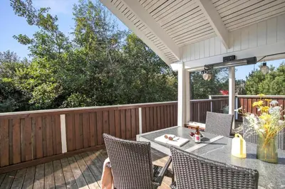 a patio with a table and chairs on a deck at JB223-Brovst-Kronvildtvej-18 in Brovst