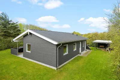 a gray house with a pitched roof on a yard at JB165-Fjerritslev-Ostersvej-16 in Fjerritslev