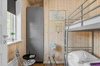 a bedroom with a bunk bed and a staircase at JB165-Fjerritslev-Ostersvej-16 in Fjerritslev