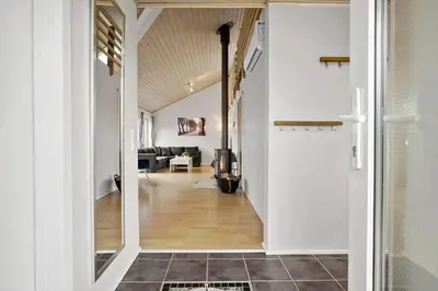 a hallway leading to a room with a living room at JB327-Brovst-Kronvildtvej-140 in Brovst