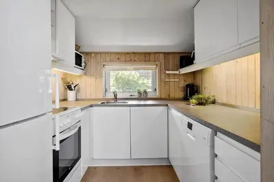 a white kitchen with a sink and a window at JB628-Fjerritslev-Lynghojsletten-49 in Fjerritslev