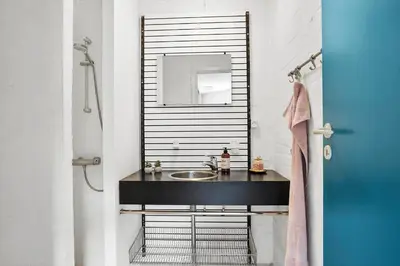 a bathroom with a sink and a mirror at JB1108-Frostrup-Strandvejen-67 in Frøstrup