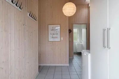 a bathroom with wooden walls and a light fixture at JB283-Frostrup-Andreas-Lassens-Vej-6 in Frøstrup
