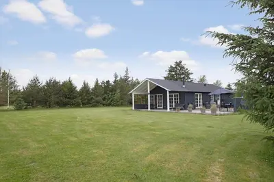 a house in a field with a large yard at JB283-Frostrup-Andreas-Lassens-Vej-6 in Frøstrup