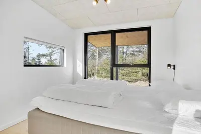 two beds in a white room with windows at JB190-Fjerritslev-Stenhusvej-34-B in Fjerritslev