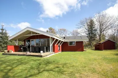 a small red house with a red barn on a field at JB391-Fjerritslev-Perikumvej-62 in Fjerritslev