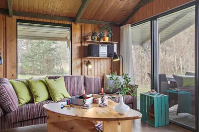 a living room with a couch and a table at JB391-Fjerritslev-Perikumvej-62 in Fjerritslev