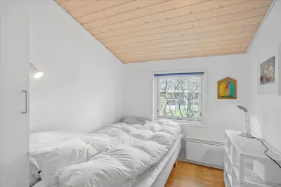 a row of beds in a room with a window at JB167-Fjerritslev-Revlingestien-83 in Fjerritslev