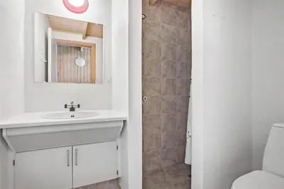 a white bathroom with a sink and a shower at JB255-Fjerritslev-Blabaerstien-22 in Fjerritslev