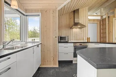 a kitchen with white cabinets and a counter top at JB888-Fjerritslev-Aspevej-15 in Fjerritslev