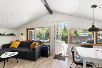 a living room with a couch and a table at JB272-Fjerritslev-Ronnevej-14 in Fjerritslev