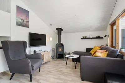 a living room with a couch and a fireplace at JB272-Fjerritslev-Ronnevej-14 in Fjerritslev