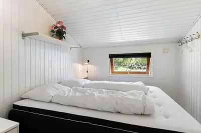 a bedroom with two beds in a white room at JB272-Fjerritslev-Ronnevej-14 in Fjerritslev