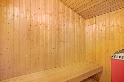 a wooden sauna with a bench in it at JB179-Fjerritslev-Slojbrovej-77 in Fjerritslev
