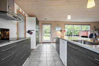 a large kitchen with a sink and a counter at JB313-Fjerritslev-Fiskerstien-7 in Fjerritslev