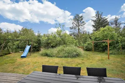 a playground with a slide in a yard at JB313-Fjerritslev-Fiskerstien-7 in Fjerritslev