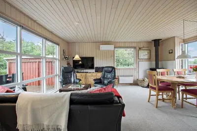 a living room with a couch and a table at JB313-Fjerritslev-Fiskerstien-7 in Fjerritslev