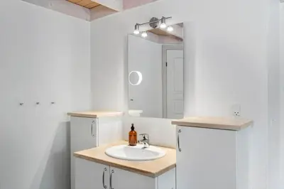 a bathroom with a sink and a mirror at JB251-Fjerritslev-Egevej-5 in Fjerritslev