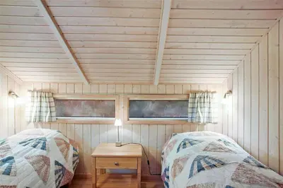 a room with two beds and a table at JB138-Fjerritslev-C-J-Thaningsvej-3 in Fjerritslev
