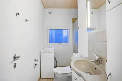 a bathroom with a sink and a toilet at JB138-Fjerritslev-C-J-Thaningsvej-3 in Fjerritslev