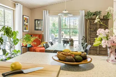 a dining room with a table with a bowl of fruit at JB295-Brovst-Ildervej-7 in Brovst