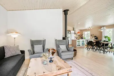 a living room with a couch and chairs and a table at JB295-Brovst-Ildervej-7 in Brovst