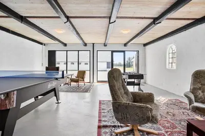 a room with a ping pong table and chairs at JB200-Fjerritslev-Udklitvej-168 in Fjerritslev
